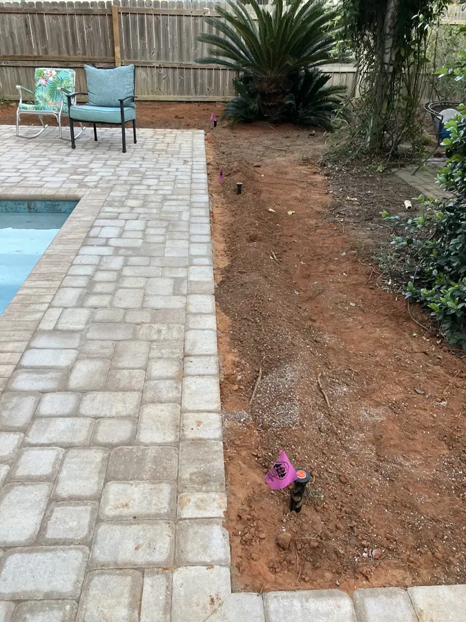 New bed along a paver pool deck